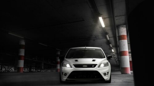 White Ford Focus ST Sports Car in Concrete Parking Garage Desktop Wallpaper
