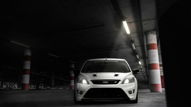 White Ford Focus ST Sports Car in Concrete Parking Garage Desktop Wallpaper