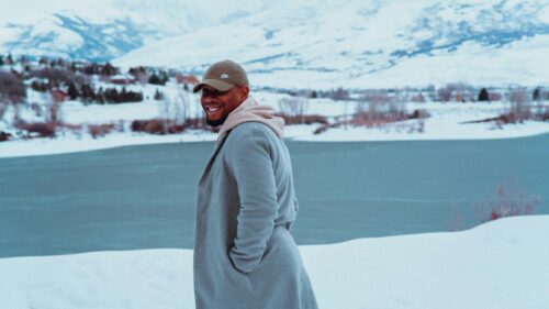 Smiling Man in Winter Landscape Outfit 4K Desktop Wallpaper