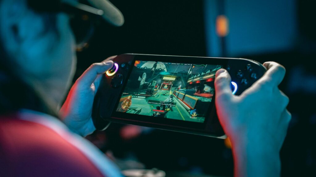 Immersive Handheld Gaming Session Desktop Wallpaper