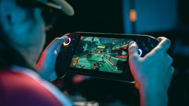 Immersive Handheld Gaming Session Desktop Wallpaper
