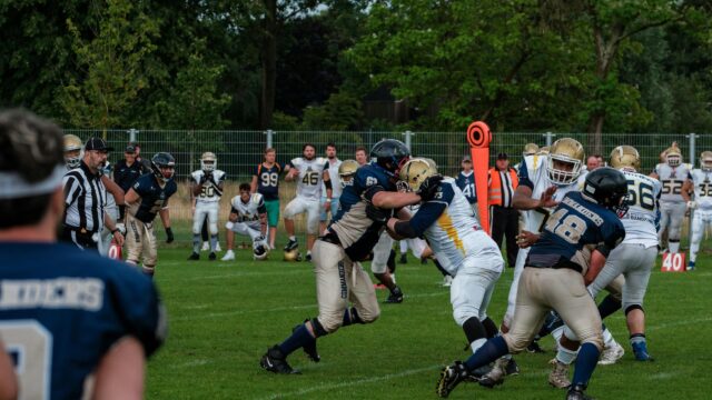 Intense American Football Line Scrimmage 4K Wallpaper
