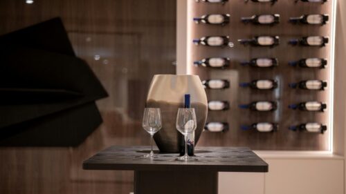 Sophisticated Wine and Crystal Glass Set on Modern Table 4K Wallpaper