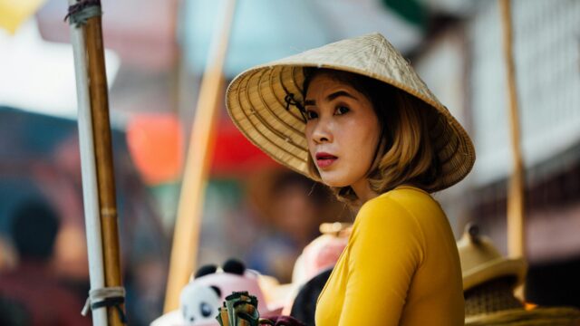 Portrait of a Woman in Traditional Conical Hat 4K Desktop Wallpaper