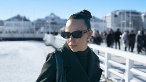 Chic Woman in Winter Fashion on Snowy Pier Desktop Wallpaper
