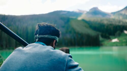 Man Looking at Turquoise Mountain Lake 4K PC Wallpaper