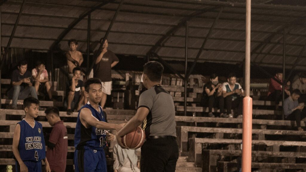 Basketball Referee Handing Ball to Player High Resolution Desktop Wallpaper