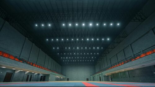 Empty Indoor Sports Arena with High Ceiling and Stadium Seating 4K Wallpaper