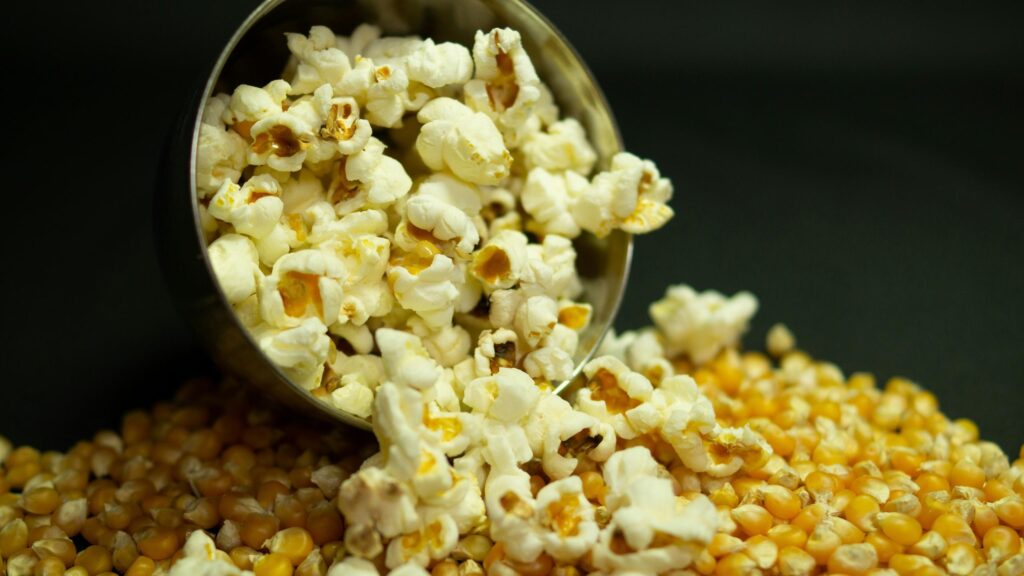 Popcorn Bowl and Unpopped Corn Kernels 4K Desktop Wallpaper