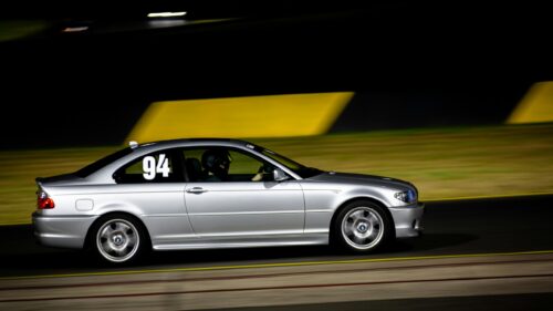 Silver BMW E46 Coupe Racing at Night Track 4K Desktop Wallpaper