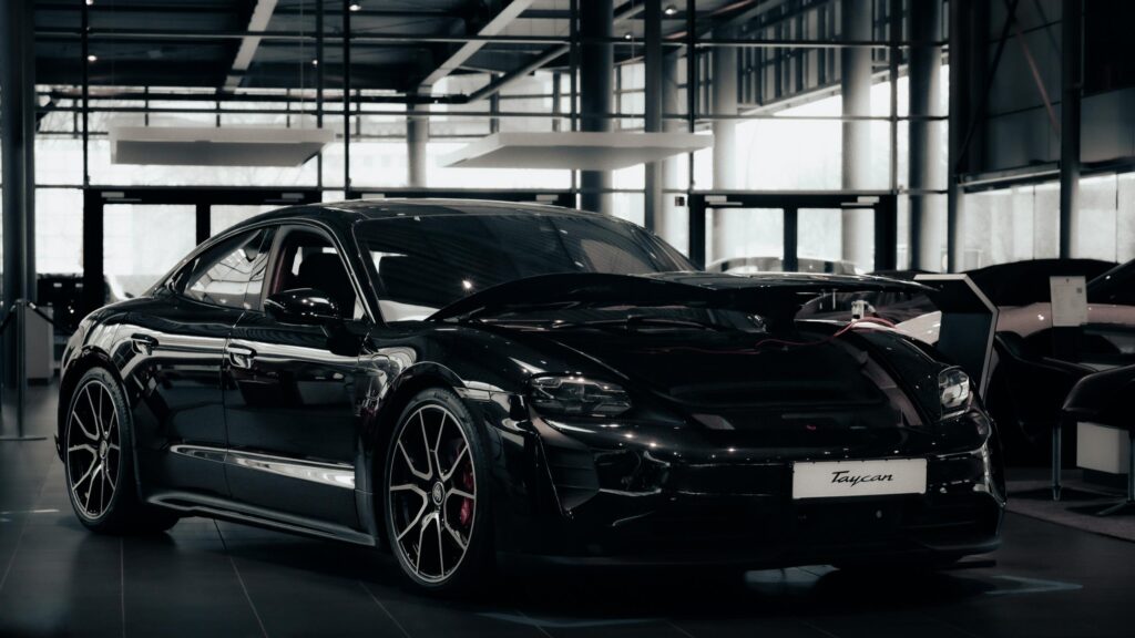 Sleek Black Porsche Taycan Luxury Electric Sports Car 4K Wallpaper