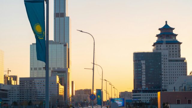 Astana Golden Hour Urban Skyline with Kazakhstan Flags 4K Wallpaper