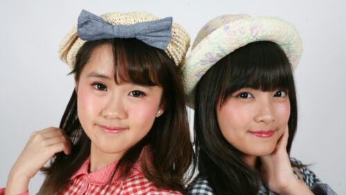 Two Beautiful Young Asian Women in Stylish Summer Hats 4K Wallpaper