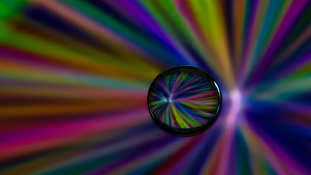 Abstract Prism Glass Sphere with Radiant Colorful Light Rays 4K Wallpaper