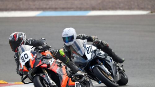 Professional Motorcycle Racing Bikes in Action 4K Wallpaper