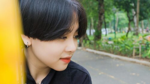 Close-up Portrait of a Stylish Young Woman in the Park 4K Wallpaper