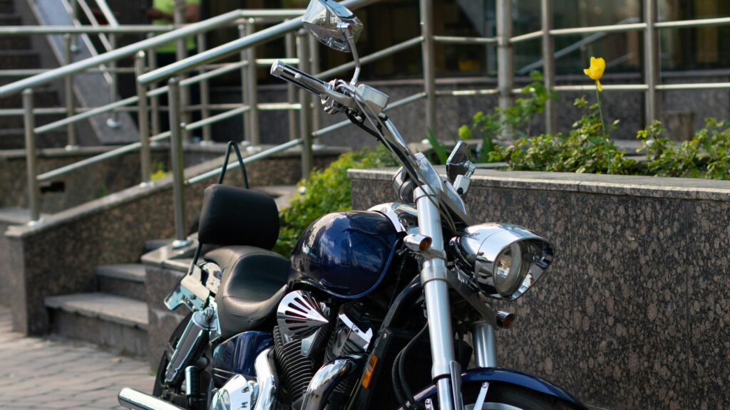 Dark Blue Cruiser Motorcycle parked on City Street Desktop Wallpaper