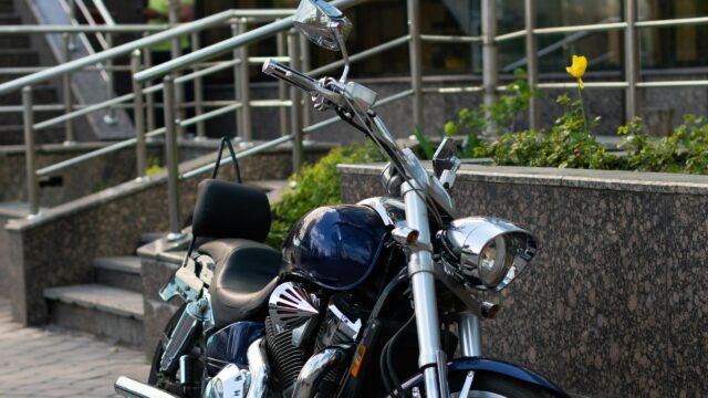 Dark Blue Cruiser Motorcycle parked on City Street Desktop Wallpaper