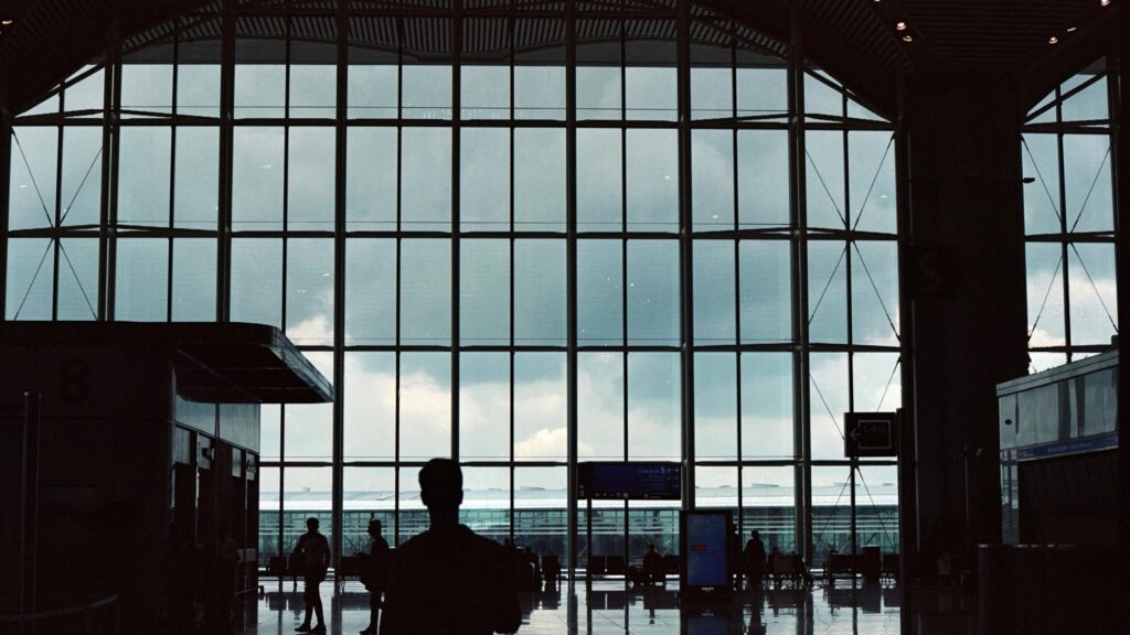 Silhouette of a Traveler at Airport Terminal Terminal Window PC Wallpaper