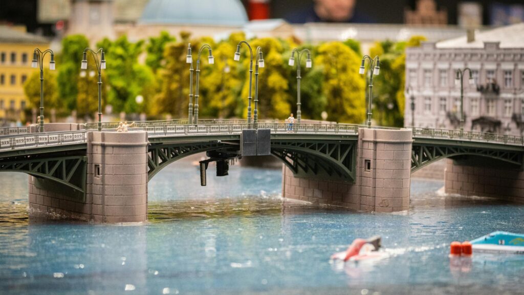 Miniature City Bridge Model Over Water 4K Desktop Wallpaper
