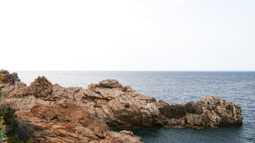 Rugged Granite Coastal Cliffs Overlooking the Blue Sea Desktop Wallpaper