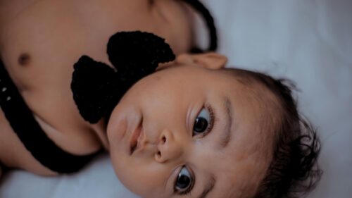 Close-up Portrait of a Cute Baby Boy Wearing a Black Bow Tie Desktop Wallpaper