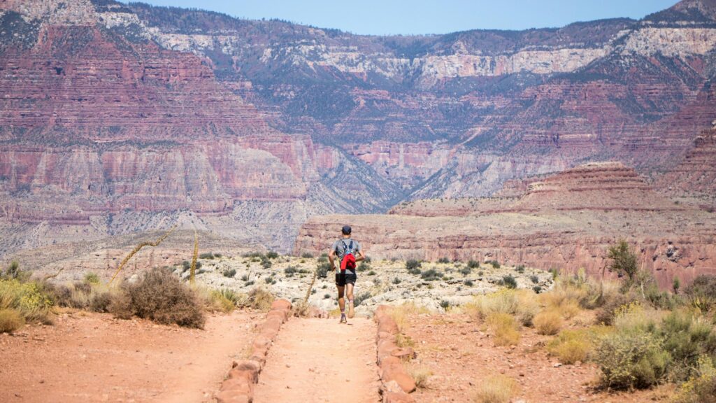 Runner on Grand Canyon Trail Adventure 4K Desktop Wallpaper