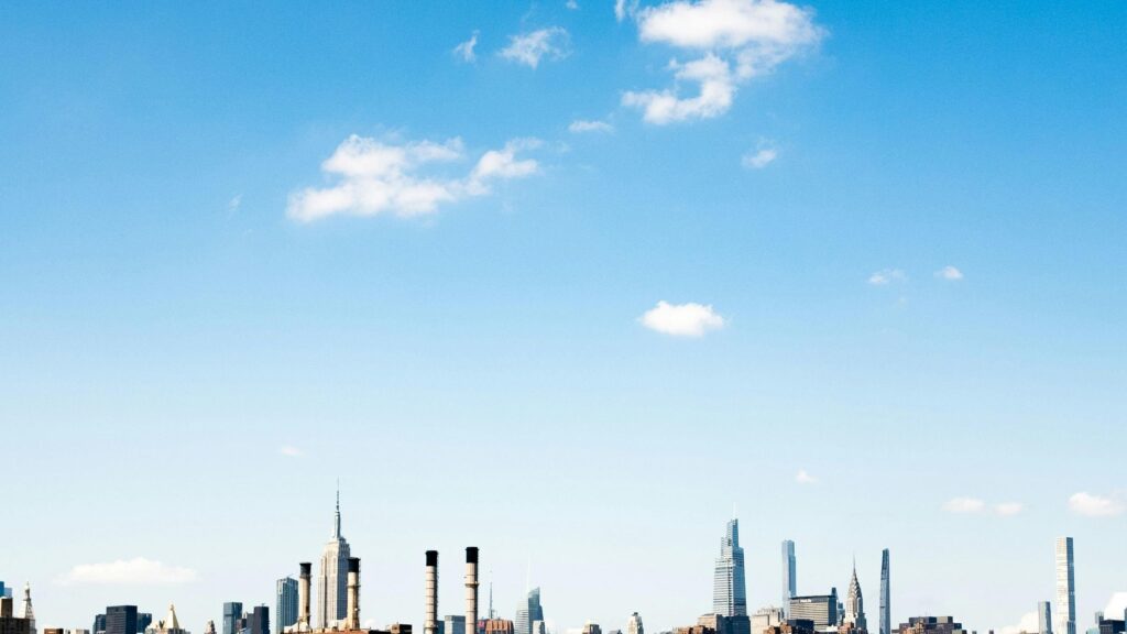 New York City Skyline Under Sunny Blue Sky Desktop Wallpaper