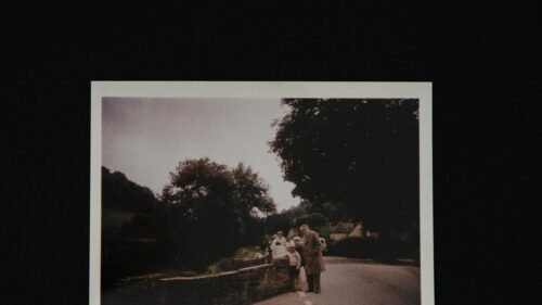 Vintage Countryside Road with Family Standing on Stone Wall Desktop Wallpaper