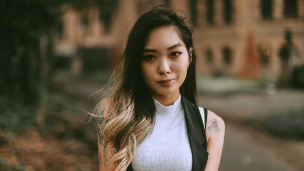 Stunning Asian Woman with Tattoos and Piercing Portrait 4K Wallpaper
