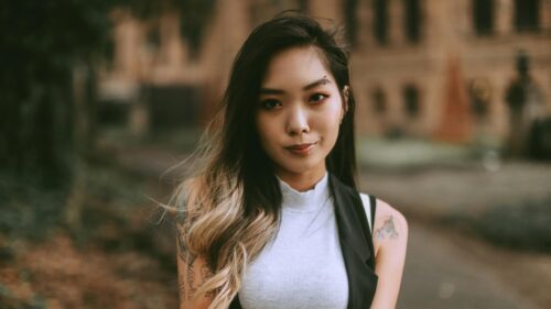 Stunning Asian Woman with Tattoos and Piercing Portrait 4K Wallpaper