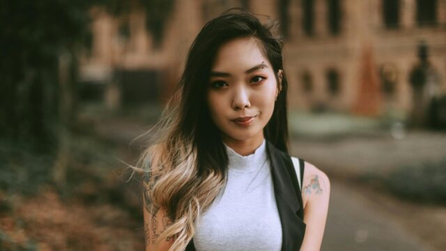 Stunning Asian Woman with Tattoos and Piercing Portrait 4K Wallpaper