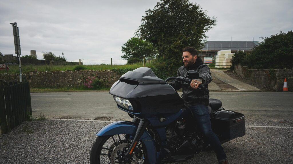 Biker Riding a Custom Blue Harley Davidson Road Glide 4K Wallpaper