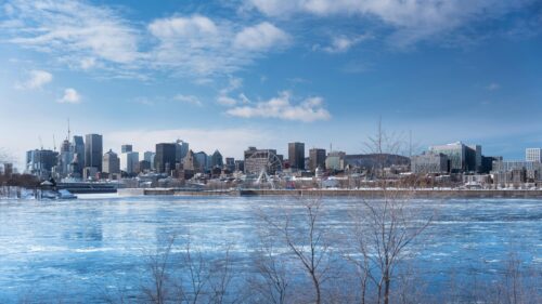 Montreal Cityscape with Frozen River and Ferris Wheel 4K Wallpaper