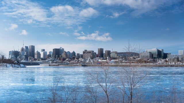 Montreal Cityscape with Frozen River and Ferris Wheel 4K Wallpaper