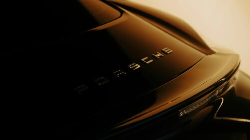 Sleek Black Porsche Rear View Close-up Luxury 4K Wallpaper