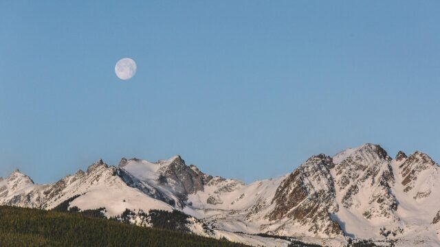 Moon Over Majestic Snowy Mountain Peaks 4K Desktop Wallpaper