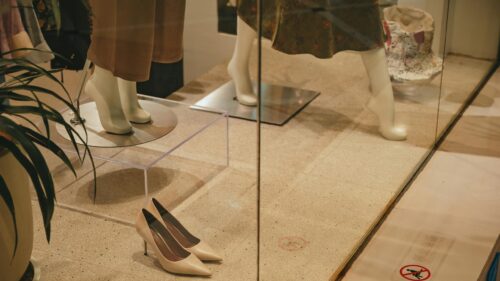 Fashionable Boutique Window Display with Mannequins Desktop Wallpaper