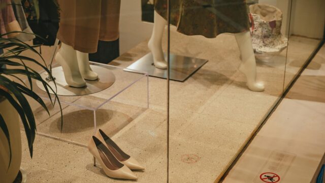 Fashionable Boutique Window Display with Mannequins Desktop Wallpaper