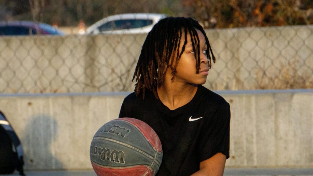 Young Basketball Player With Dreadlocks Outdoor Training Desktop Wallpaper