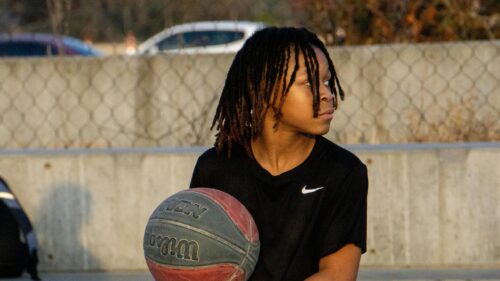 Young Basketball Player With Dreadlocks Outdoor Training Desktop Wallpaper