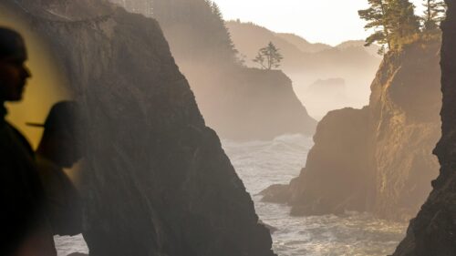 Misty Coastal Cliffs and Ocean Waves at Golden Hour 4K Wallpaper