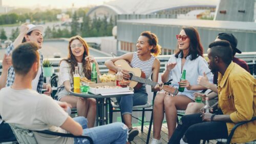 Friends Having Fun at Rooftop Party 4K Desktop Wallpaper