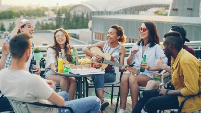 Friends Having Fun at Rooftop Party 4K Desktop Wallpaper