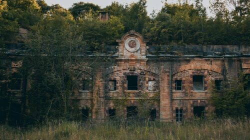 Abandoned Ancient Fort Ruins in Lush Overgrown Forest Desktop Wallpaper