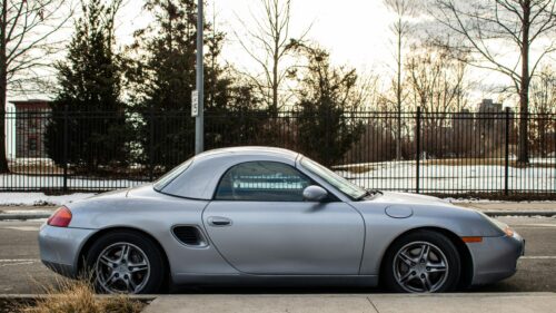 Silver Porsche Boxster Sports Car parked on a quiet street Desktop Wallpaper