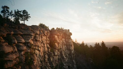 Stunning Rocky Cliffside at Golden Hour 4K Desktop Wallpaper