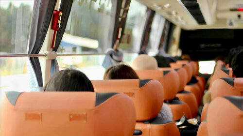Bus Travel Interior View with Orange Seats Desktop Wallpaper