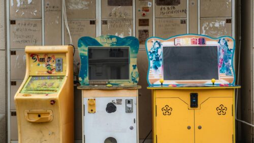 Vintage Retro Arcade Cabinets Against Storage Lockers PC Wallpaper