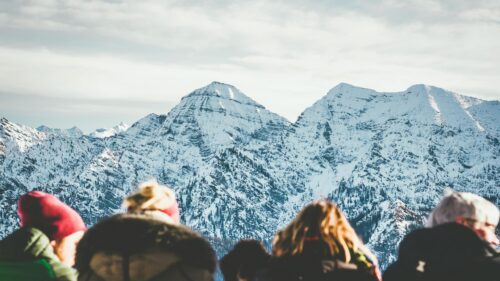Snowy Mountain Peaks With Hikers Viewing Landscape Desktop Wallpaper